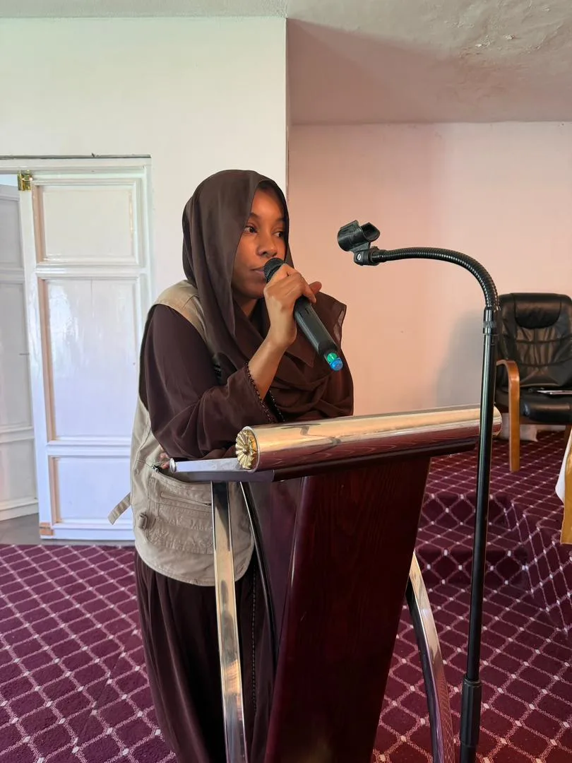 A Golden Umrah advisor speaking to pilgrims at an orientation event